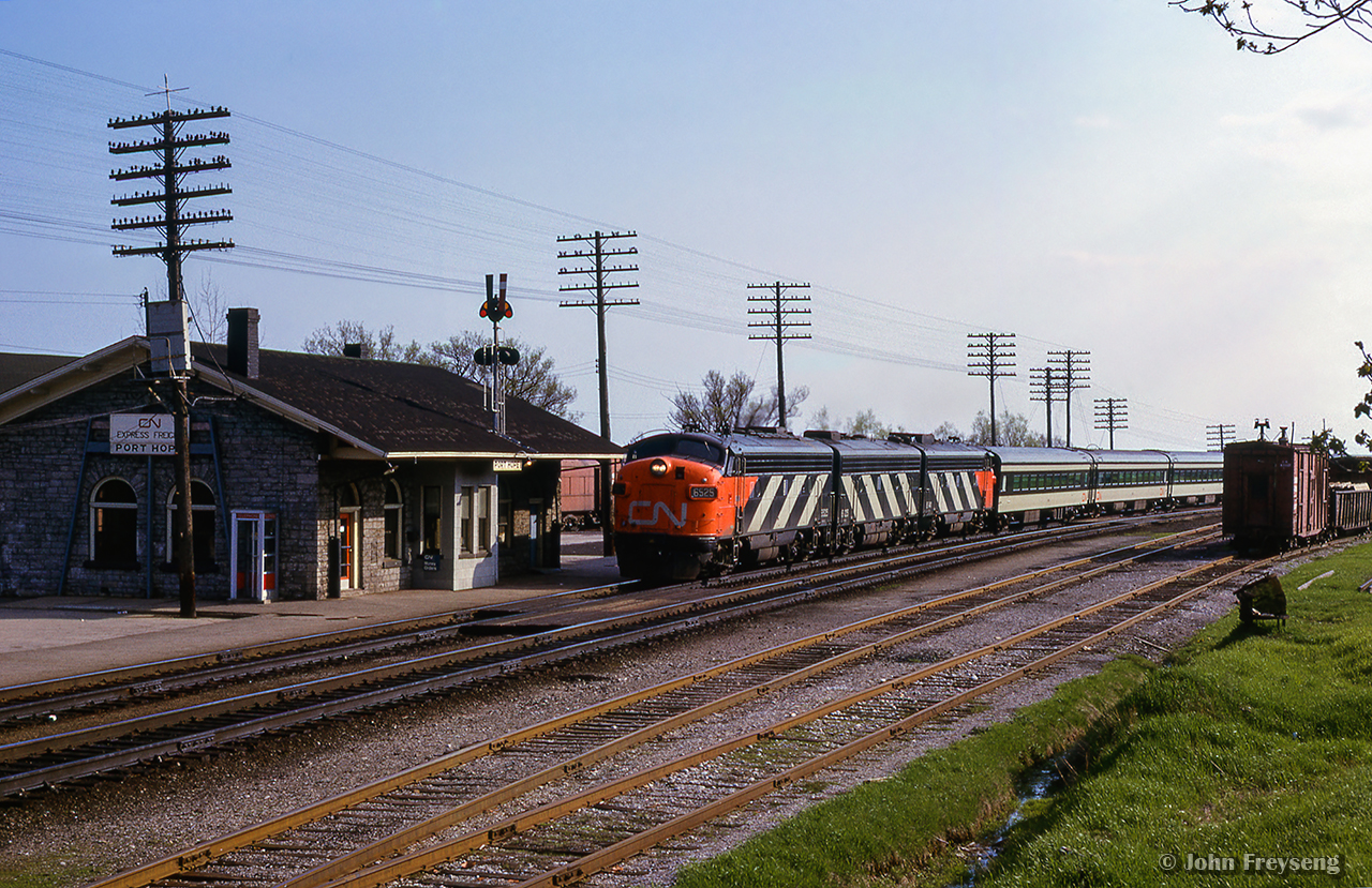 CN Rapido number 64 is about an hour into its 4 hour, 59 minute journey from Toronto Union Station to Gare Centrale Montreal as it blasts by Port Hope behind an A-B-A set of zebra-striped GMD FP9s.

Scan and editing by Jacob Patterson.