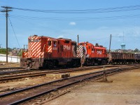 A pair of first generation diesels bring a cut of ore cars into Sudbury yard.<br><br><i>Scan and editing by Jacob Patterson.</i>