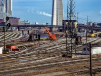 A minor derailment involving a pair of b-units in the Spadina coach yard is in the process of being cleaned up on a warm December day.

<br><br><i>Scan and editing by Jacob Patterson.</i>