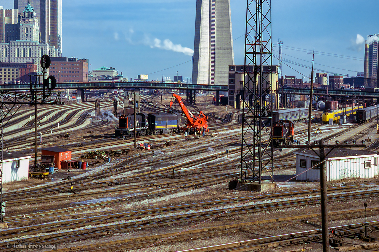 A minor derailment involving a pair of b-units in the Spadina coach yard is in the process of being cleaned up on a warm December day.

Scan and editing by Jacob Patterson.