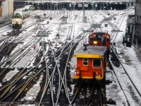 A snowy day around Toronto Union station finds MLW S13 8515 moving through the double slip switches with a transfer van while a GO train powered by GMD GP40TC 726 departs westbound.

<br><br><i>John Freyseng Photo, Jacob Patterson Collection Slide.</i>