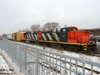 Pictured are two trains, 540 in front framed in the nice fencing at "Granite Homes" property between Alma and Edinburgh (A great place to watch trains), and in the far left you can see 542 having cleared the mainline and are about to head north to the Guelph Junction Railway. L540 is shown on the siding as they've cleared the mainline to meet VIA 85 who would pass by 5 minutes later. Remember these GMD-1's? They were so common around here for a few years. At least one is near by on <a href=http://www.railpictures.ca/?attachment_id=45238 target=_blank>Waterloo Central</a>. :)

