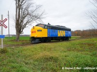 VIA 6539, former OSR 1400 now owned by the <a href=https://viahistory.ca/home/ target=_blank>Via Historical Association</a> along with OSR employees and the members of the VIA crammed in the Cab take a joyride on the Port Burwell subdivision as they cross Macbeth Line in Salford. This was entirely unexpected as I saw the members cram into the cab and then someone said they were going south.... vha had a couple runpasts in private in the middle of fields then back to the shop.