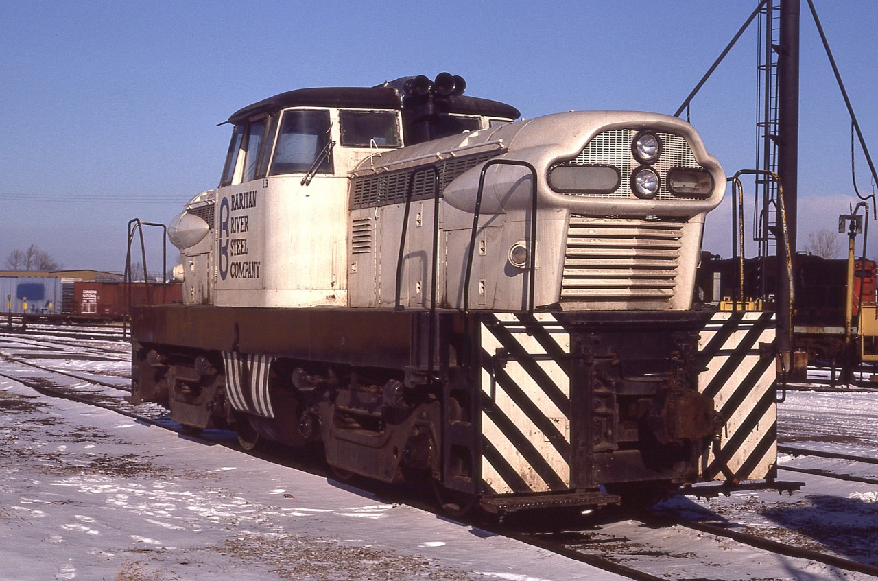 This is a repeat, but a different angle of a shot I posted 12 years ago (#7089) and is worth a second look. This one of 4 even made, a GMDH-1, (diesel-hydraulic) of which were built between 1955 and 1959, resting at Fort Erie for a bit on its trip from South Amboy, New Jersey to Hudson Bay Oil and Gas near Fox Creek, Alberta. It may still be in operation up there. (Thanks, Robin Lowrie, for noting it was at the Kaybob facility of HBOG)
The waybill states that, delivered to Canada via Conrail, that is was "shipped on its own wheels with the driveshaft disconnected". The bill was issued at Black Rock NY and the unit had been in the CN yard a few days before I got to see it.
The units were experimental, and made in London. Two of these double hooded units had a pair of 6 cylinder engines, model 110, and produced 600 HP. It weighted 51 tons The other two, model 71 engines, produced 800 HP and weighted 74 tons. This information I found in the "2nd Diesel Spotters Guide" by Pinkepank, 1973.