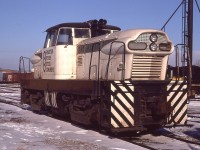 This is a repeat, but a different angle of a shot I posted 12 years ago (#7089) and is worth a second look. This one of 4 even made, a GMDH-1, (diesel-hydraulic) of which were built between 1955 and 1959, resting at Fort Erie for a bit on its trip from South Amboy, New Jersey to Hudson Bay Oil and Gas near Fox Creek, Alberta. It may still be in operation up there. (Thanks, Robin Lowrie, for noting it was at the Kaybob facility of HBOG)
The waybill states that, delivered to Canada via Conrail, that is was "shipped on its own wheels with the driveshaft disconnected". The bill was issued at Black Rock NY and the unit had been in the CN yard a few days before I got to see it.
The units were experimental, and made in London. Two of these double hooded units had a pair of 6 cylinder engines, model 110, and produced 600 HP. It weighted 51 tons The other two, model 71 engines, produced 800 HP and weighted 74 tons. This information I found in the "2nd Diesel Spotters Guide" by Pinkepank, 1973.