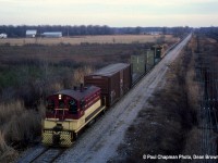 TH&B SW900 57 heads northbound on the TH&B Fort Erie Sub at the QEW, looking towards Fort Erie. The CN Stamford Sub is on the right.