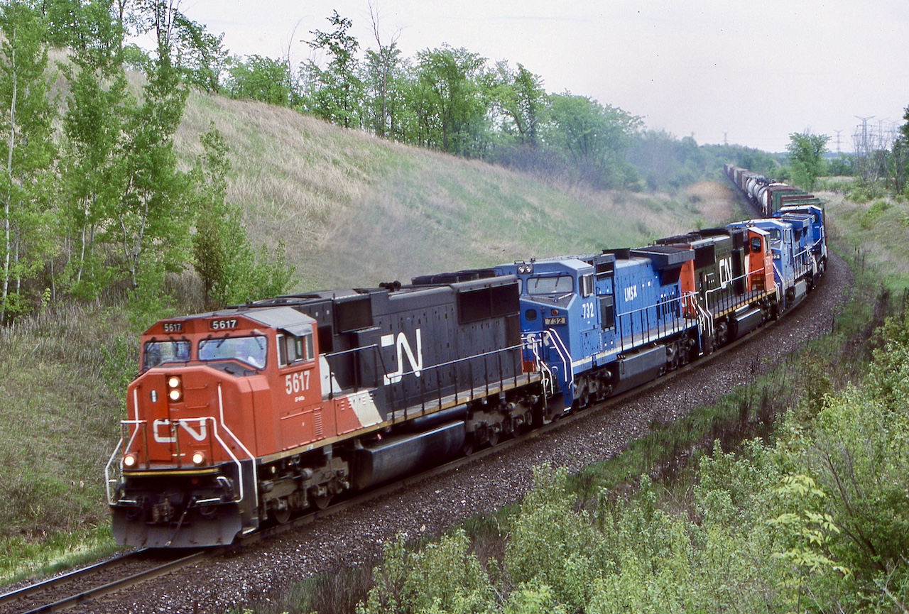 CN train 334 was definitely one of the more interesting trains back in this time period. NS and former Conrail units showed up often on both 334/335. Unfortunately the routing of this traffic was later changed to Montreal instead of Toronto and the Niagara region lost yet another train. This day the trio of LMS Dash-8 was kind of interesting and considering the time period it was possible they were in transit to CN as part of its split lease of part of the fleet. When CSX and NS split up Conrail, the split leased LMS units were finally divided three ways between CN, NS and CSX. Later all of the railroads would either fully repaint, or patch the ex LMS fleet.