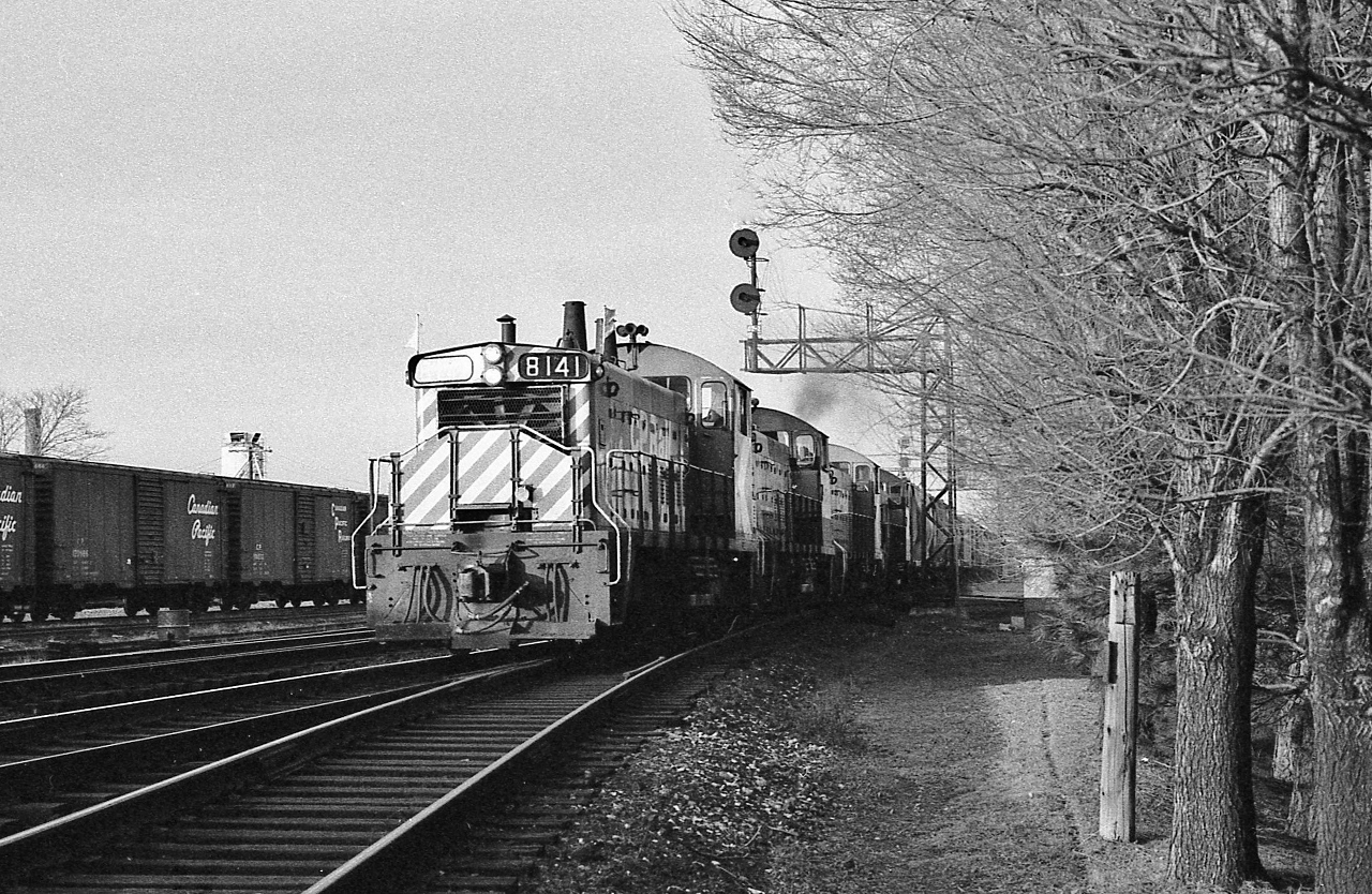 Extra 8141 West – with four pups, three with the CP Rail multimark on the cab - hits the Leaside diamond


Mile 206.0 Belleville Sub-Division


Mile 0.0 North Toronto Sub-Division


At Leaside, December 1978 Kodak Tri X negative by S.Danko



Likely The London Pickup ?


The first track – immediately to the left - is the Belleville Sub-Division  ' Don branch ' to Don station at mile 209.5 and onto the TTR trackage controlled by TTR Cherry Street Leverman.