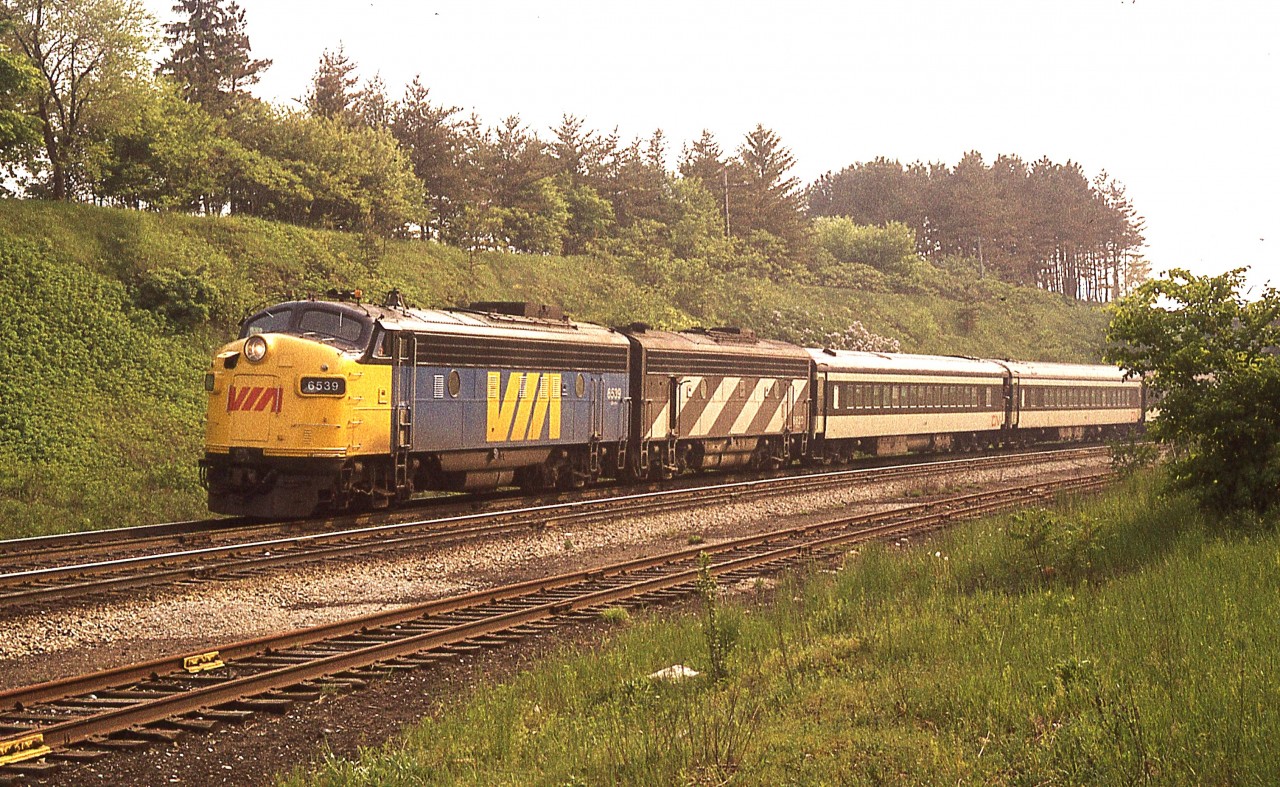 I was very intrigued by the unveiling of the "new" VIA 6539 at Salford, Ontario. (Thank you, Mr. Host) and got to wondering if I had ever seen this unit back in the day. Did manage to come up with this image from summer 1978, showing VIA 6539 leading 6623 coming eastbound off the Dundas hill toward Bayview. Shots in the afternoon are generally ruined by the harsh sun angles, but today, due to a lot of haze, this shot isn't all that bad.