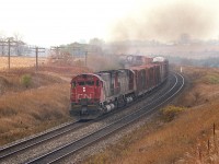 Out at Newtonville for an afternoon's train-watching.  Pity the dull weather, but it was nice to see a few of the old workhorses in action. Here a pair of MLW M-636 locos, 2316 and 2323, create a smoky haze as they power a train eastbound.