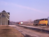 I posted a shot of this train in the CN yard about 6 years ago, but just found this image which is quite nice. In what apparently was a rare move, C&O 3584 and freshly minted WM 4355 are seen just coming into Canada, with the tail end still on the double decked Whirlpool Bridge. This train usually crosses at Fort Erie and I have no concrete idea why it was in Niagara Falls this day. It terminated at the CN yard about a mile along.
On the left is the NF passenger station; it looks like it just went thru a bit of renovation. Flag poles are up, but as yet no flags.
A very quiet looking but nice warm early March morning.