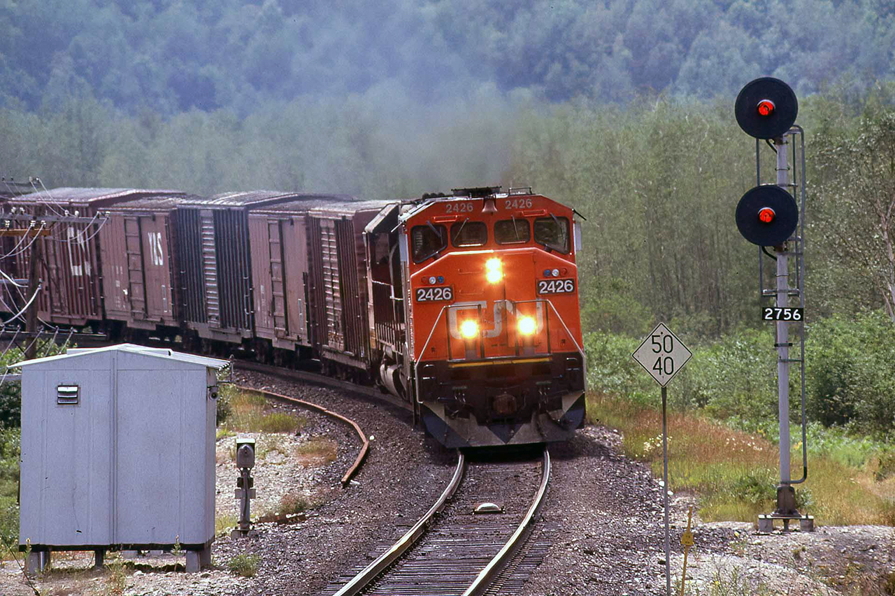 I can't really explain how I remember this being Toronto- Winnipeg 215. It was the third of the western hotshots out of Toronto behind 211; all pigs and pool cars to Winnipeg, 217 to Vancouver, and this one cleaned up the details. There was usually a large cut of empty lumber flats on the tail end that would go through to Edmonton, and most to Prince George from there. The C40's were just arriving on the property and this may well have been a first trip west where coal, grain and potash service awaited.