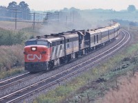 <br>
<br>
An all Canadian passenger train.
<br>
<br>
Designed in Canada. Engineered in Canada. Manufactured in Canada.
<br>
<br>
All weather, proven robust design. Operating on time. Reliable too.
<br>
<br>
MLW's at Speed on a steamy Labour Day weekend. 
<br>
<br>
At track speed, two baggage cars - head end and rear - the afternoon Bonaventure: Ottawa section removed at Brockville  
<br>
<br>
The view from the Bee Bridge, September 3, 1978 Kodachrome by S.Danko
<br>
<br>
also
<br>
<br>
Upper right: the Newtonville Rd bridge over the CP Rail Belleville Sub. 
<br>
<br>
Captured by a trustworthy Nikkor 135mm F1.8 lens with a sturdy Nikkormat EL.
<br>
<br>
