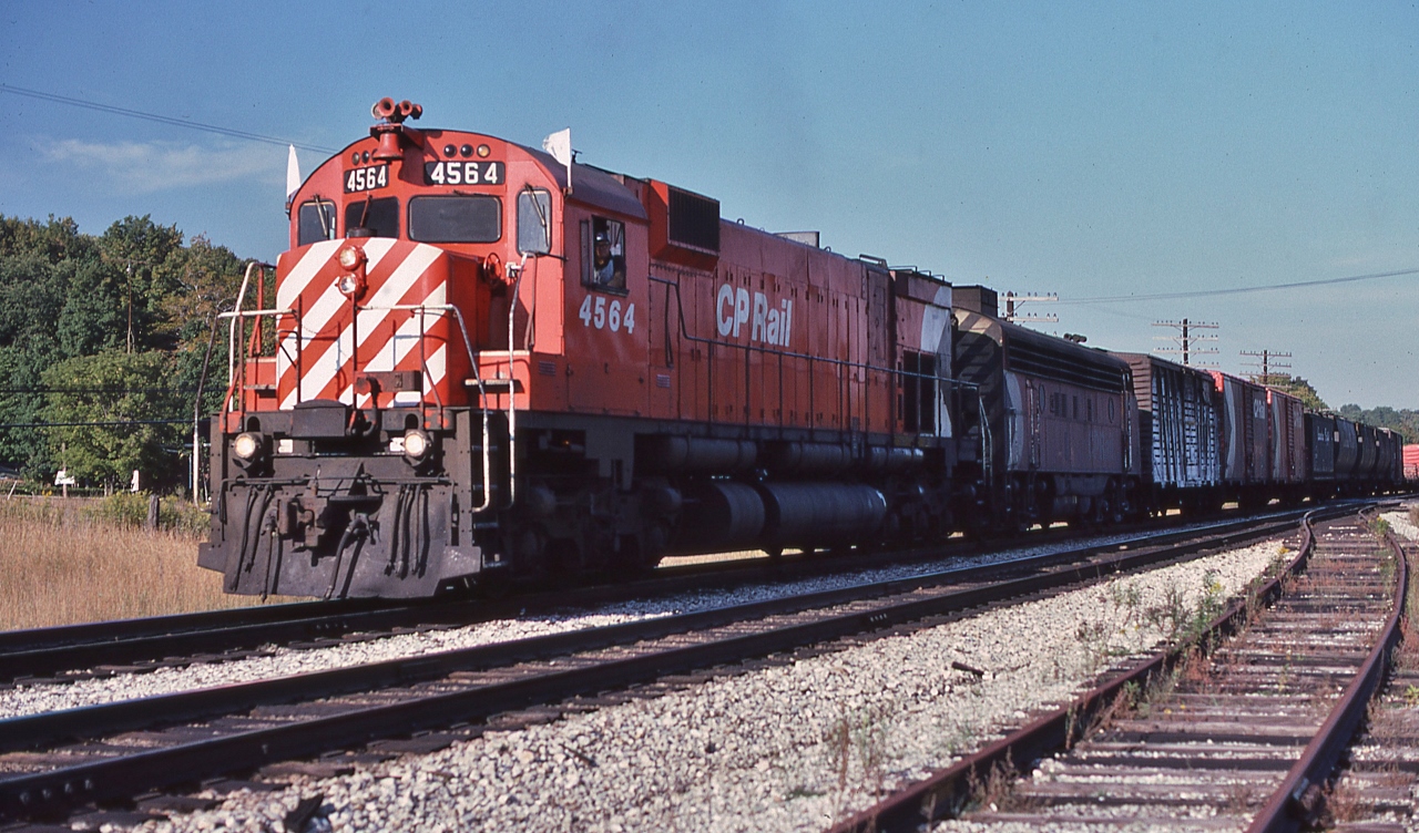 Seventies Rail Fanning: The big attraction was the variety of power.....


And mixing six axle seventies super power with four axle first generation,


and there is a good reason for this type of lashup: some set offs restrictions required four axle only power


and on the head end, as required by law: a 'working' livestock rolling stock...


White Markers & White Flags for CP Rail Extra West 4564 near Guelph Junction, September 16, 1978 Kodachrome by S.Danko.


More seventies super power


       big M units