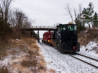 Me and a buddy made our way to Toronto yard on the morning of December 4th as we knew a work train was showing to dump CWR on the Mactier sub. Instead, we arrive to "the plow train" calling in the yard over the scanner. As they depart Toronto yard with Jordan Spreader CP 402894 and SD40-2 CP 5920, they tell RTC the plan: "up the Mactier sub, picking up a foreman in Midhurst, plowing maybe Medonte, definitely Buckskin & Bala; leave the plow in Bala and light power to Mactier. And the chase was on! Here they are ducking under the infamous 9th Line bridge near Beeton ON.