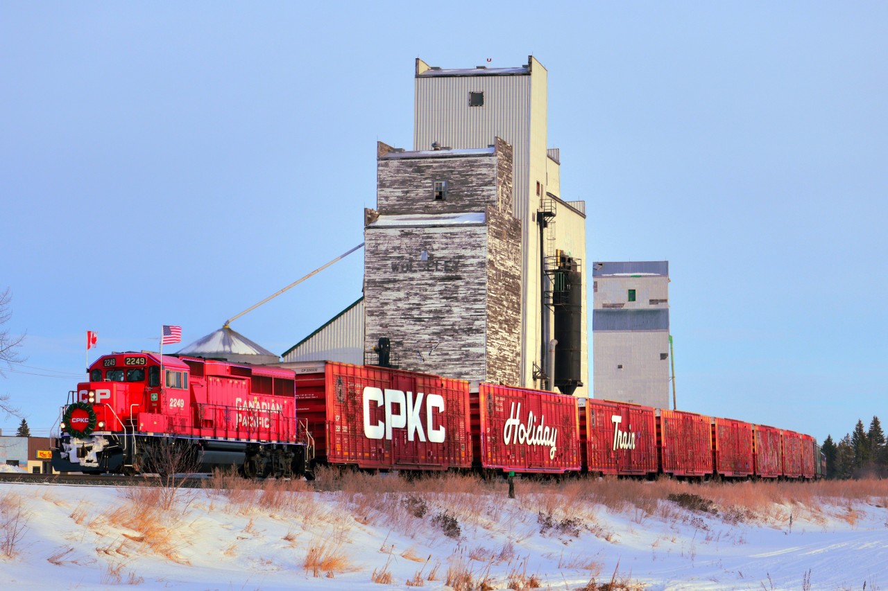 Wolseley is home to two wooden grain elevators, both still in service. Here, CP 2249, leading the Holiday Train, blasts by on its journey to the stop in Indian Head. They ended up being ahead of schedule arriving in Indian Head by about 10 minutes, and from what I was known they were about 40 minutes behind earlier in the day.