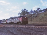 A sunny warm October afternoon, CN 6789 leading train #142 off the Dundas subdivision and eastward to Toronto. Nice sequential numbers on the loco 6-7-8-9. CN 6541 is the second unit. "Kodak Instamatic Memory" from long ago.