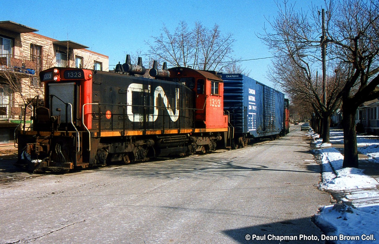 CN 549 with CN SW1200RS 1323 heads to the GM Ontario St. plant.