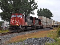 CN 5715 and 6012 roar southbound through Hanmer, Ontario with one of CN's many intermodal trains.