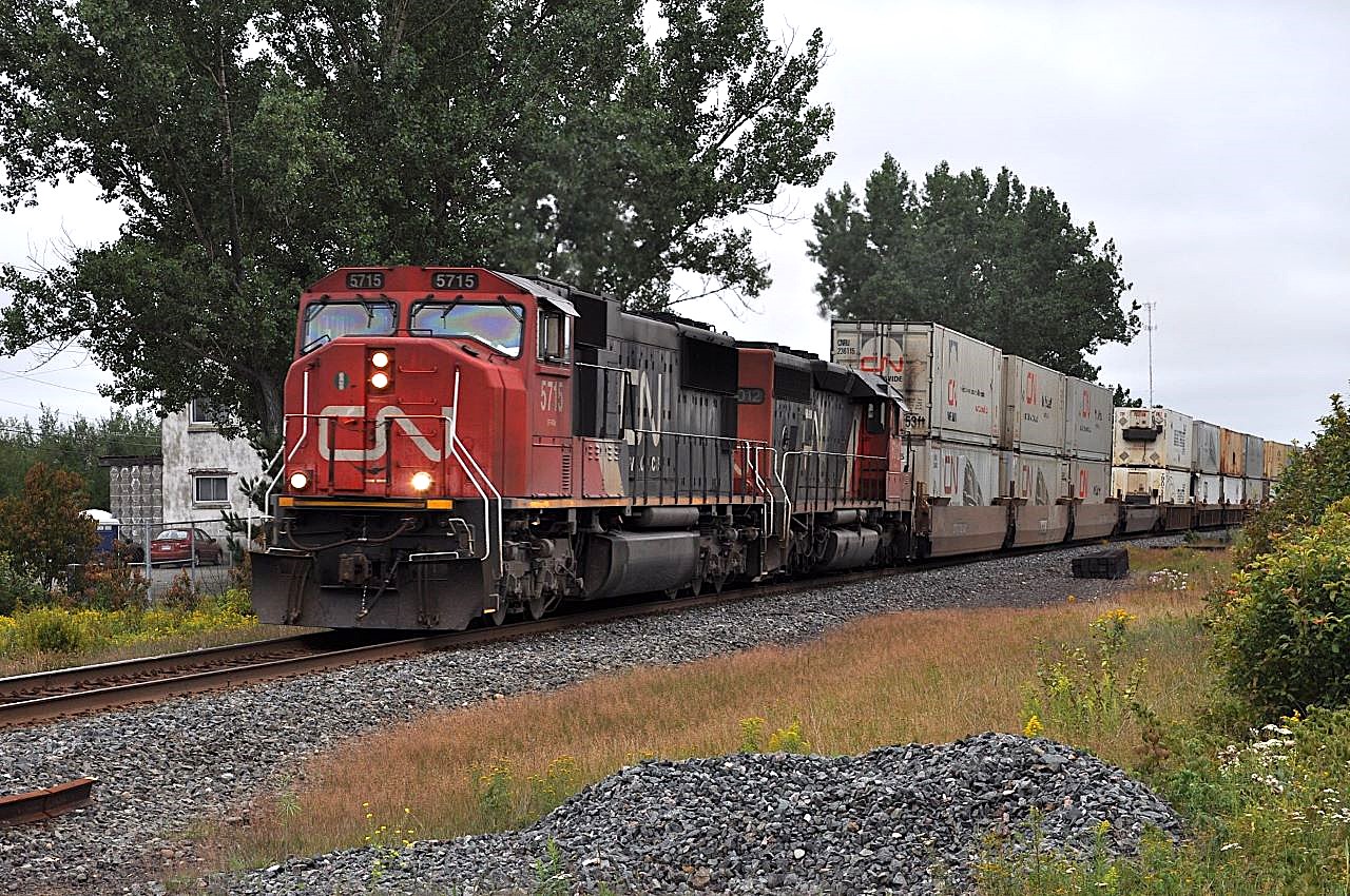 CN 5715 and 6012 roar southbound through Hanmer, Ontario with one of CN's many intermodal trains.