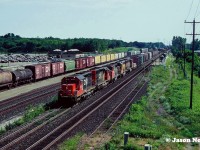 With its class lights on, CN SD40u 6004 heads west through the Aldershot, Ontario station on the Oakville Subdivision either destined for the Dundas or Grimsby Subdivisions. Behind the remanufactured SD is mix of units that includes another recently rebuilt SD40u and a newly acquired Union Pacific SD40-2 that would be later rebuilt into a CN 5300-series SD40-2 at AMF in Montreal, Quebec.