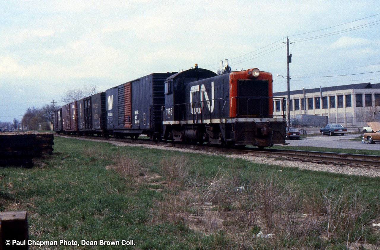 CN SW8 7165 is heading southbound from the GM Ontario Street plant to Merritton.