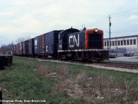 CN SW8 7165 is heading southbound from the GM Ontario Street plant to Merritton.