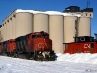 Midland is in the snowbelt and this photo continues its reputation.The Turn ran out of time and decided to layup overnite at Tiffin Elevator.Midland had 5 elevators at one time, now there's one without rail service.