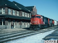 On February 13, 2003, a CN train had derailed almost 30 cars of general freight near Gobles, which sits east of Woodstock, Ontario on the CN Dundas Subdivision. Nearby residents were evacuated because the tankers involved were carrying benzene liquid and petroleum gas. Due to this incident and further complications during the clean-up effort, CN detoured some trains over the GEXR Guelph Subdivision between Georgetown and London over several days. 
<br>
My photo here shows an afternoon detour CN train 385 going westbound by the Stratford, Ontario station on the GEXR Guelph Subdivision. The lash-up was CN SD70I 5623 and SD75I 5705. 
