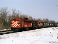 A southbound drag freight approaching the station with a mixed consist