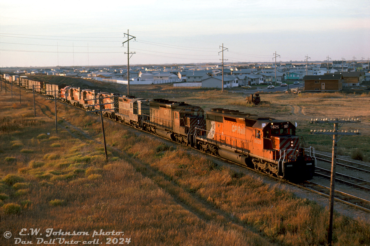 There's no shortage of power on this extra freight rolling into Saskatoon, seen passing through the suburbs of Sutherland at the Highway 5/College Dr. overpass before arriving at CP's Sutherland Yard. CP SD40-2 5625 and 5582 lead GP9 units 8484 (still in maroon & grey script paint), 8701, 8683 and 8685, and a fresh-looking SW900 6711 trailing with stack capped.

Motive power sheets show 6711's regular assignment at the time was Edmonton, so it could have been coming back from Winnipeg's Weston Shops after receiving some maintenance work (it wasn't equipped with MU so wasn't online). All the GP9's shown were Winnipeg-based numbers, so they're possibly being forwarded for branchline assignments in the region.

Eric W. Johnson photo, Dan Dell'Unto collection slide.