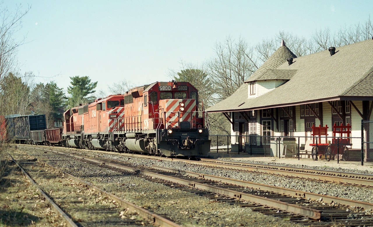 Far from the hey-day I knew at the "Sound"; the once popular CP station is now a commercial enterprise (at least it is still standing) and in the foreground one can see the passing track is being lifted and now it is just one main line track thru town.
This was a nice angle for north bounds; the foliage has been taking over in recent years though.  Power on this manifest is CP 5800, 9014 and 5617.