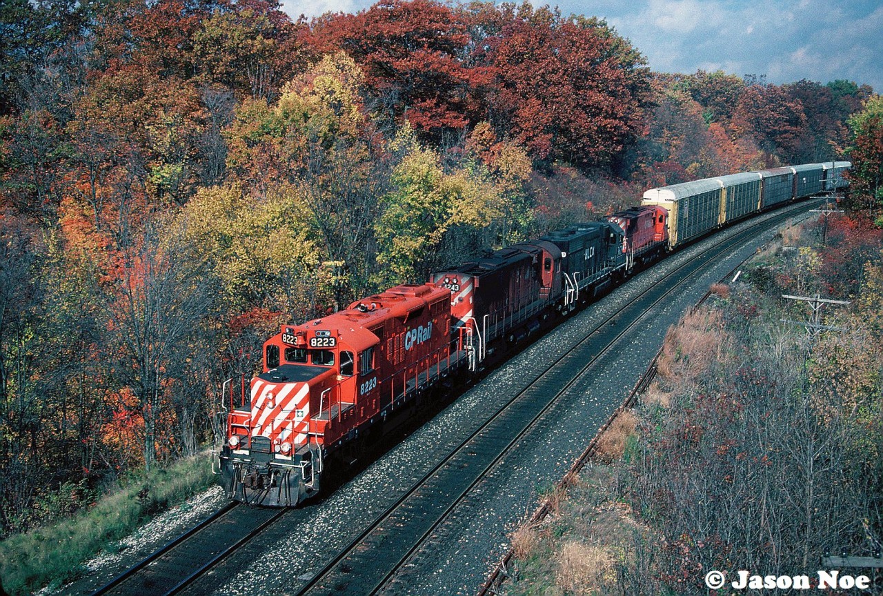 This October afternoon was predominantly overcast when we arrived at Bayview Jct. in Burlington, Ontario, however as each hour ticked by, the clouds gave away to some substantial sunny breaks.

Here, a CP westbound catches ones of those breaks as it heads towards Hamilton with a consist typical of the time period that included: CP GP9u 8223, C-424 4243, HLCX GP38AC 3679 and another C-424. HLCX 3679 was ex-IC 9547 and nee-GMO 728.