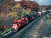 This October afternoon was predominantly overcast when we arrived at Bayview Jct. in Burlington, Ontario, however as each hour ticked by, the clouds gave away to some substantial sunny breaks.
<br>
Here, a CP westbound catches ones of those breaks as it heads towards Hamilton with a consist typical of the time period that included: CP GP9u 8223, C-424 4243, HLCX GP38AC 3679 and another C-424. HLCX 3679 was ex-IC 9547 and nee-GMO 728.
