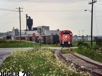 The CP/STLH “Grand River Job” based out of Galt Yard in Cambridge, Ontario is busy switching the very large Uniroyal Goodrich Plant in Kitchener, Ontario on the Goodrich Spur. The power was GP38-2’s 3042 and 3047. 