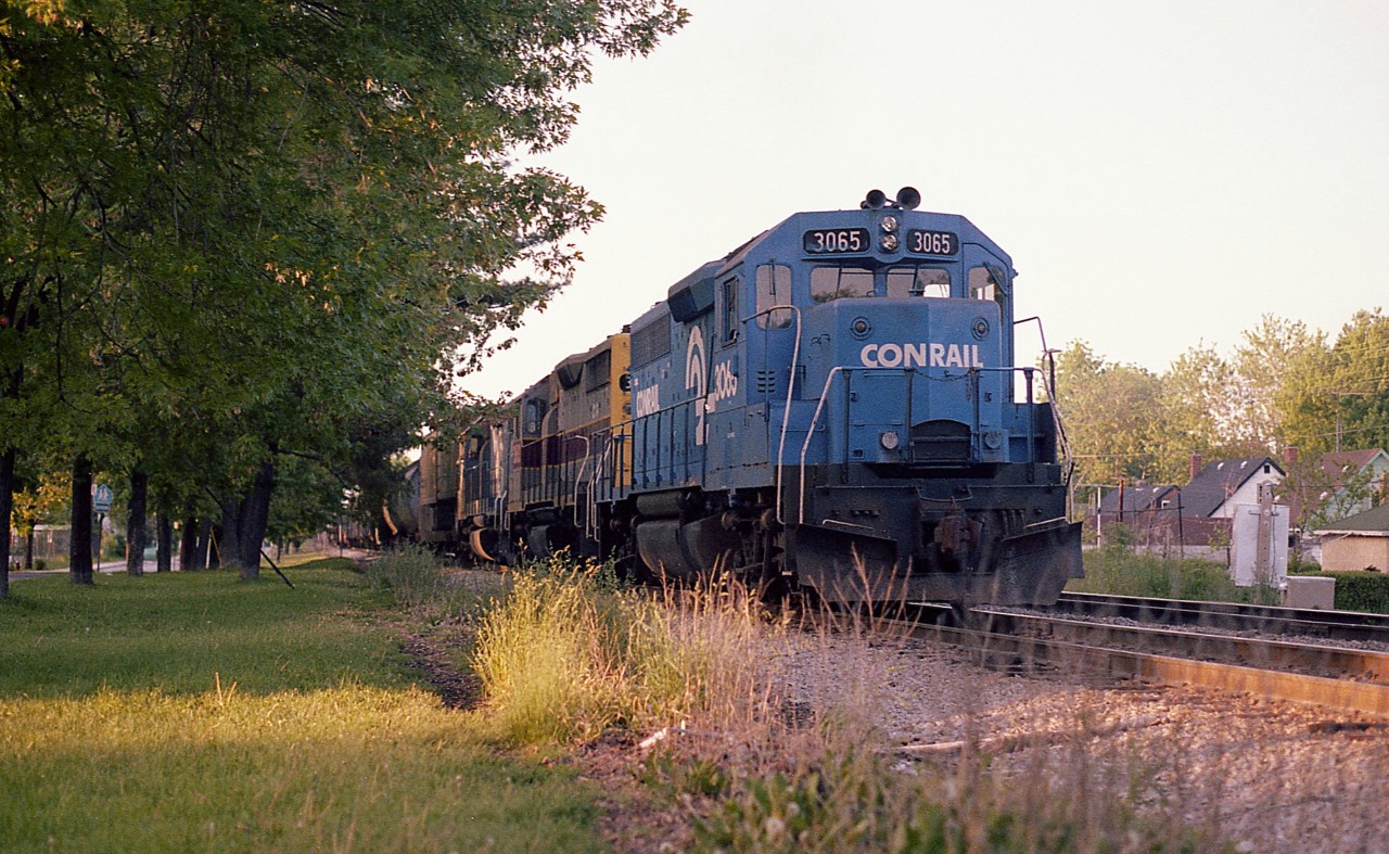 Its late in the day and the sun is going down behind the trees.  This is the usual time I would catch a train coming over the river from the USA but I was rather surprised this was Conrail power and not Chessie.  Grabbed this image along Palmer Av (visible on the left) because if I tried for a shot when it was coming up to Clifton Hill I would probably get stuck in traffic and definitely not be able to find a place to park. My usual double parking and jumping out for a photo was not making me any friends :o)  So this was it.  Power is CR 3065, 3682 (in EL paint) and 8254.