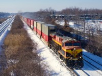 A KCS ES44AC leads stacks eastbound.