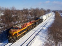 A long CPKC 231 (596 axles) has KCSM 4752 up front and CP 9752 mid-train.