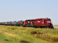 After a rather frustrating day finding not much of anything in this part of lower Saskatchewan, we were quite pleased, while heading north, to meet this southbound on the Stewart Southern Railway. A pair of leased units with 7 tank cars in tow. I have to admit the spiffy clean paint job on both was a bonus as well. FURX 5529 and CRLX 2021, a pair of GP38-2 units is the power. This was actually the first time I had ever seen a locomotive with CRLX (Canadian Railserve) reporting marks....at least one in this paint.    Nice!!