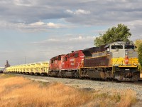  On the move eastward out of Swift Current CPKC yard is CP 7019, 5798 and 5766 with a GREX ballast dumping train. GREX 9500 is the blue spreader and behind is a long 'slot machine' string of ballast cars with excavator on rail cart.
GREX is the reporting mark of Georgetown (Texas) Rail Equipment Company. It was taken over and merged with Loram in 2018-2020 and I am wondering if the GREX identity is going to be phased out.