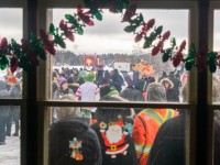 Despite thick clouds and occasional flurries, it's a big crowd waiting for the 2024 CPKC Holiday Train's stop in Cartier, ON. The former CPR station, now used by Via, is open for people to warm up and swap a donation for some hot chocolate or a baked good. These small-town stops are incomparable to the big cities, for all the right reasons.