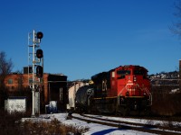 CN 322 is passing one end of the Butler Spur on a cold and windy morning.