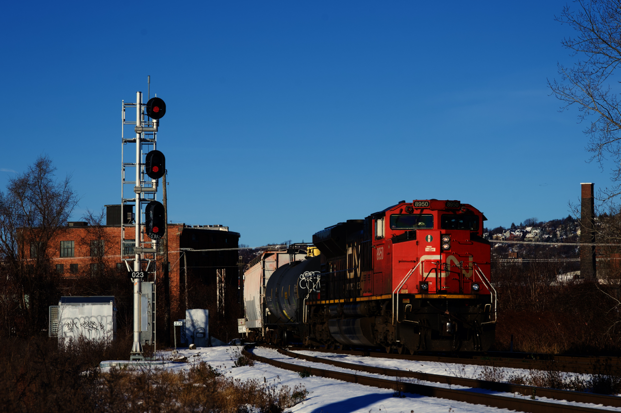 CN 322 is passing one end of the Butler Spur on a cold and windy morning.