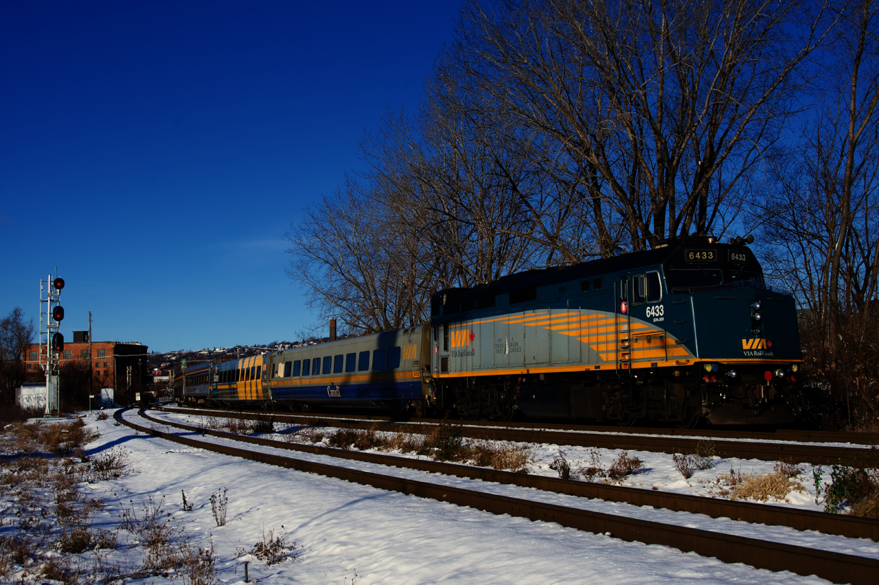 Leaving Central Station late and further delayed by CN 322, VIA 63 in Montreal last Friday morning has a mixed consist as it prepares to cross the Lachine Canal for the second time. VIA 6433 brings up the tail end.