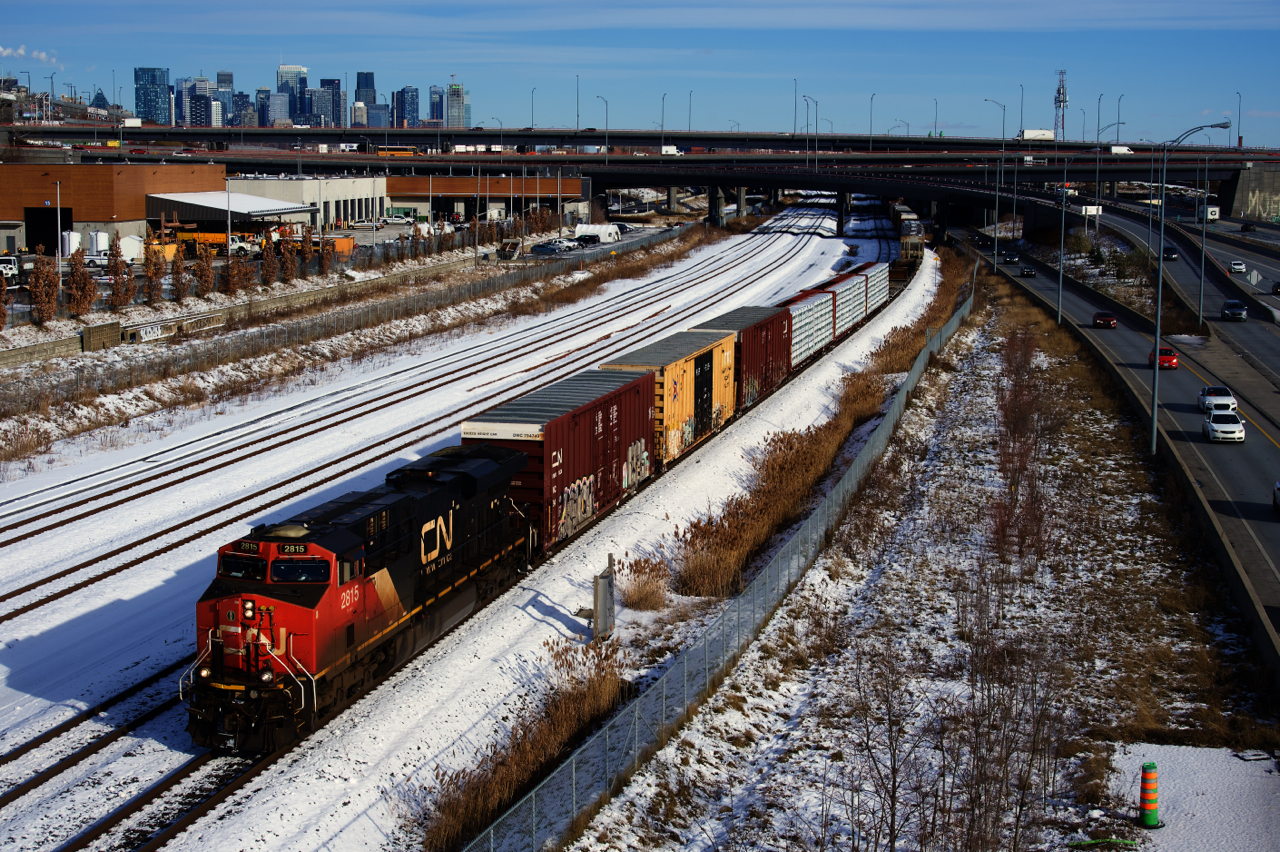 An extra passes the skyline of downtown Montreal.