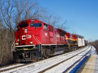 CP 7052 pops as it leads CPKC 231 through Île-Perrot, with KCS 4619 trailing.