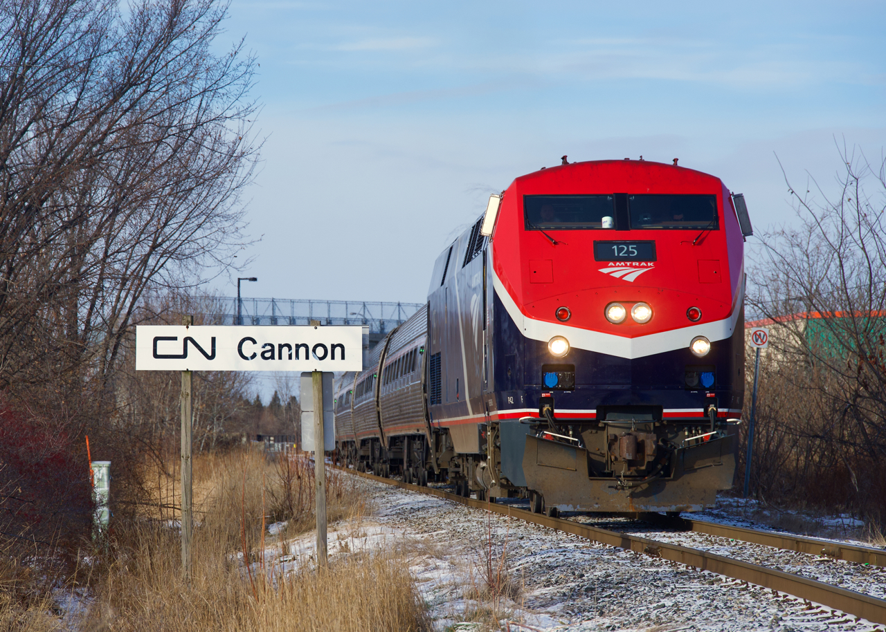 Repainted just this past June, AMTK 125 looks sharp as it passes CN Cannon. This portion of the CN Rouses Point Sub was an interurban line (the Montreal and Southern Counties) way back when.