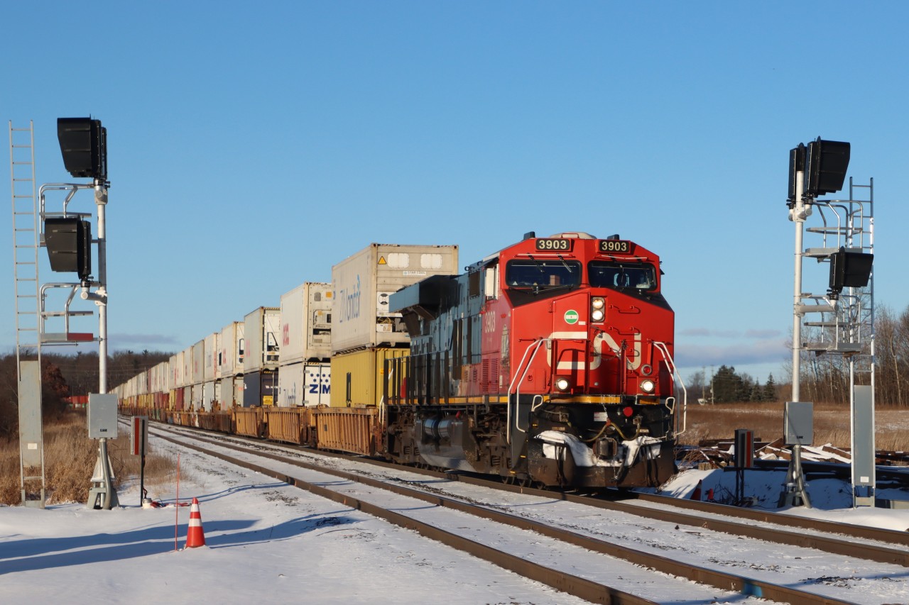 Westbound Intermodal configured DP 1-1-0 (DPU CN 2864) operating on the South Track passing what will become the future westward Advance Signal to Tansley. These signal structures were initially installed on the west side of the No 1 Sideroad crossing and have just recently been relocated?