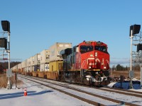 Westbound Intermodal configured DP 1-1-0 (DPU CN 2864) operating on the South Track passing what will become the future westward Advance Signal to Tansley. These signal structures were initially installed on the west side of the No 1 Sideroad crossing and have just recently been relocated?