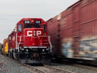 The rail train awaits its crew as 134 flies by on a chilly morning. 